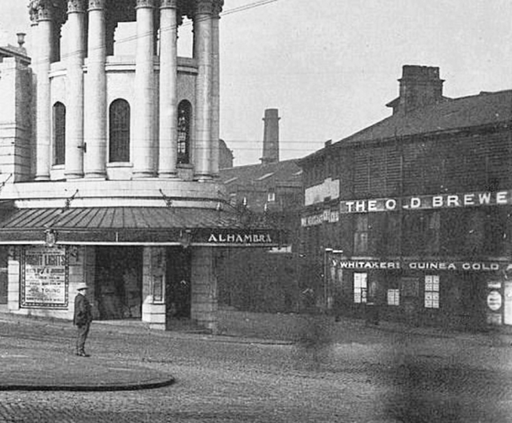 View of the Alhambra Theatre and William Whitaker & Co. Ltd: The Old Brewery, Bradford, from the foot of Victoria Square. The picture was taken between the years 1914 and 1928. 